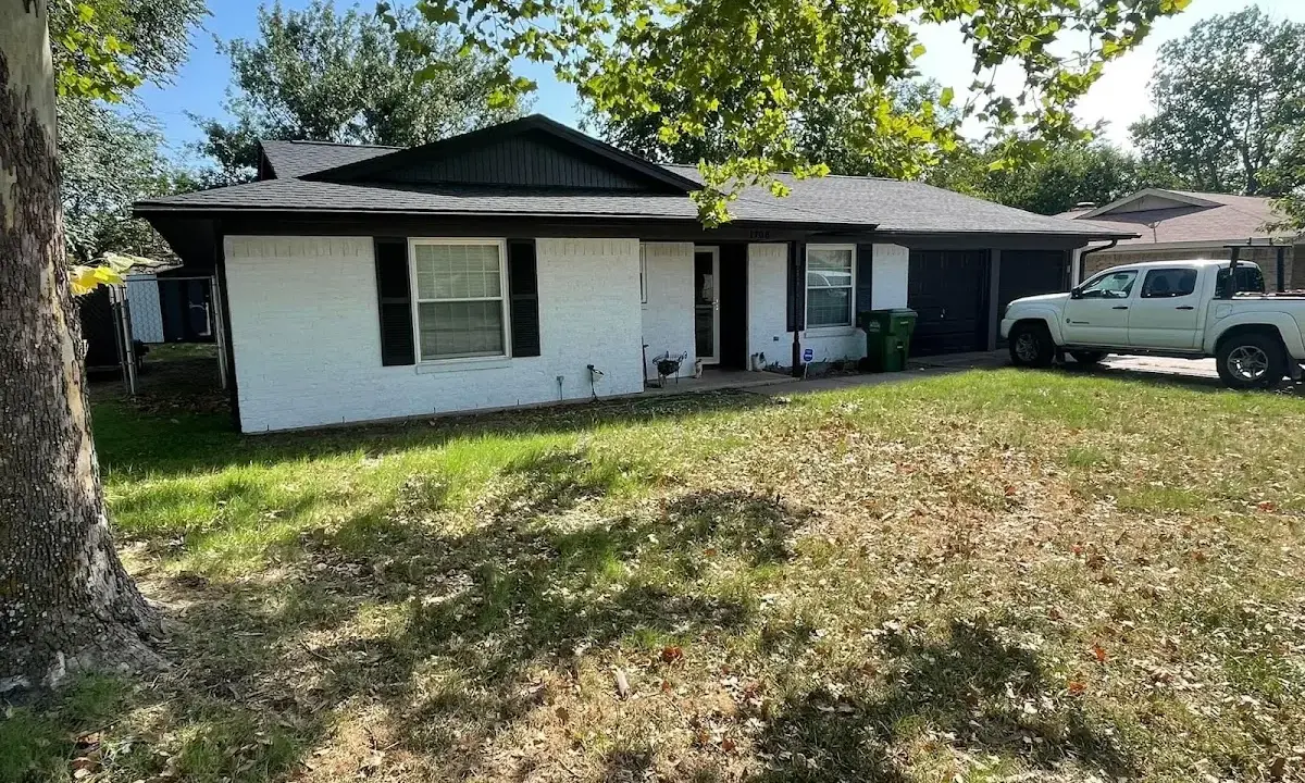 Professional roofing crew working on a residential roof in Grover Beach